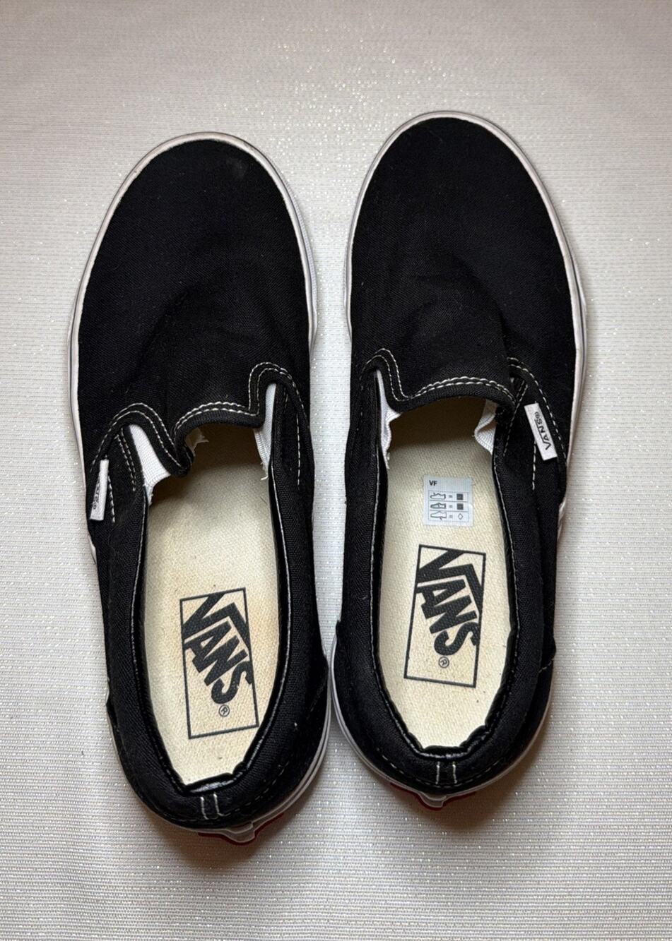 Vans Slip-On Sneakers in Black with White Women’s Size 9.5/ Men’s Size 8